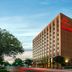The Lincoln Marriott Cornhusker Hotel in Lincoln, exterior view of the tall brick hotel at dusk.
