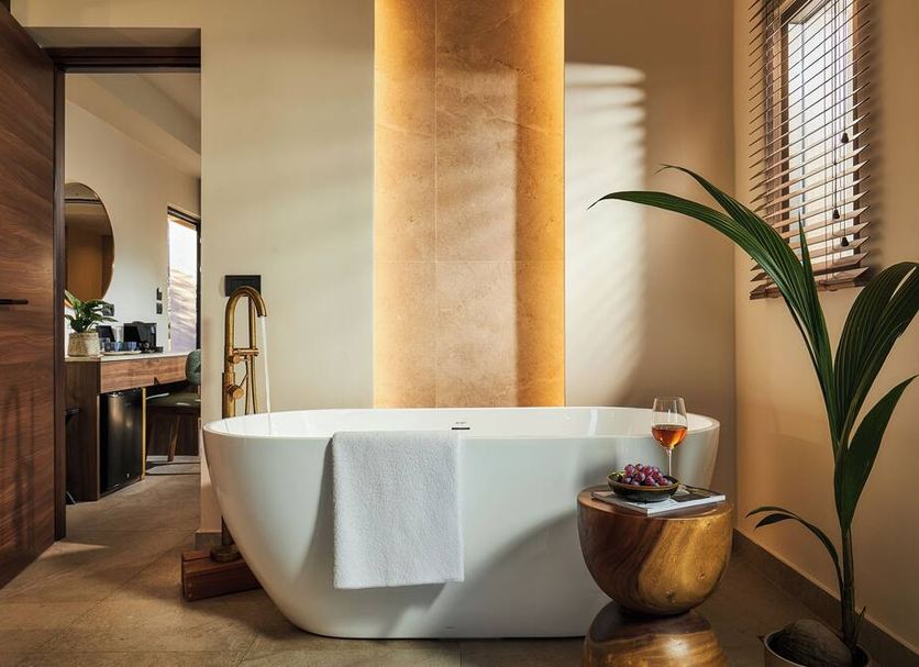 Enorme Infinity Elounda - Adults Only spa suite with freestanding tub and private seating area in Elounda