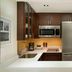 Residence Inn by Marriott Montreal Downtown kitchen with stainless steel appliances and wood cabinets