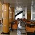 Hotel La Luna in Beni Mellal lobby lounge with orange chairs, tables, and glossy columns