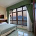 La Panoramica Hotel in Castellammare di Stabia room with large window view of sea and mountains