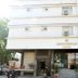 OYO 6805 The Ghoonghat Banipark hotel exterior in Jaipur with entrance and parked scooters