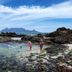 Dolphin Inn Blouberg in Cape Town with rocky tide pools and Table Mountain in the distance
