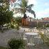 Beach Hotel Jacuma in João Pessoa with outdoor patio seating, palm trees, and garden views