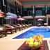 Seashell Resort Krabi in Krabi: outdoor pool with loungers and colorful umbrellas