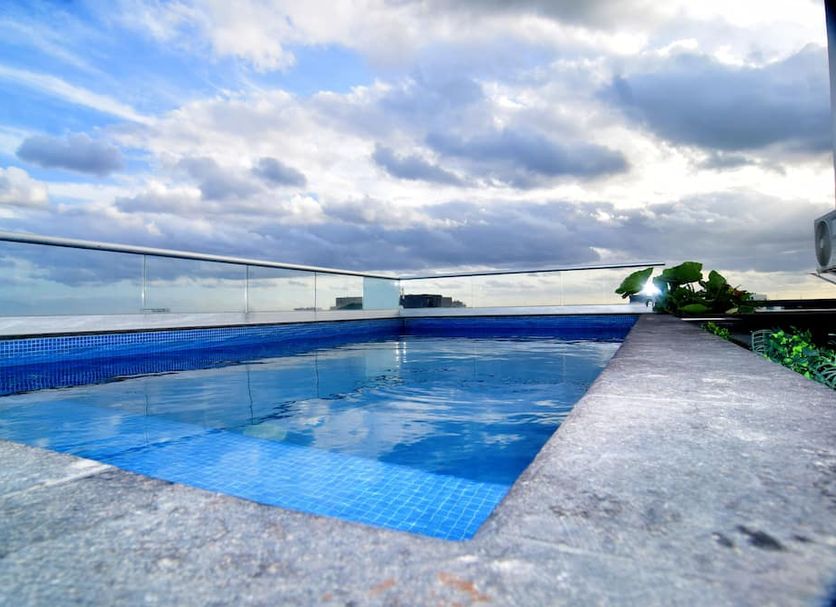 Rooftop pool at Illusion Xpress I Attraction Hotel Deluxe in Playa del Carmen with ocean views