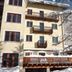 Le Samovar Guest House in Breuil-Cervinia with snow-covered balconies and a winter tree outside