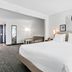 Spark by Hilton Mechanicsburg Harrisburg West guest room with king bed and seating area