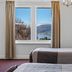 Riverfront Motel & Restaurant, Berriedale room with twin beds and river view through window