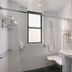 Night Hotel Broadway bathroom in New York with shower, sink, mirror and towel rack