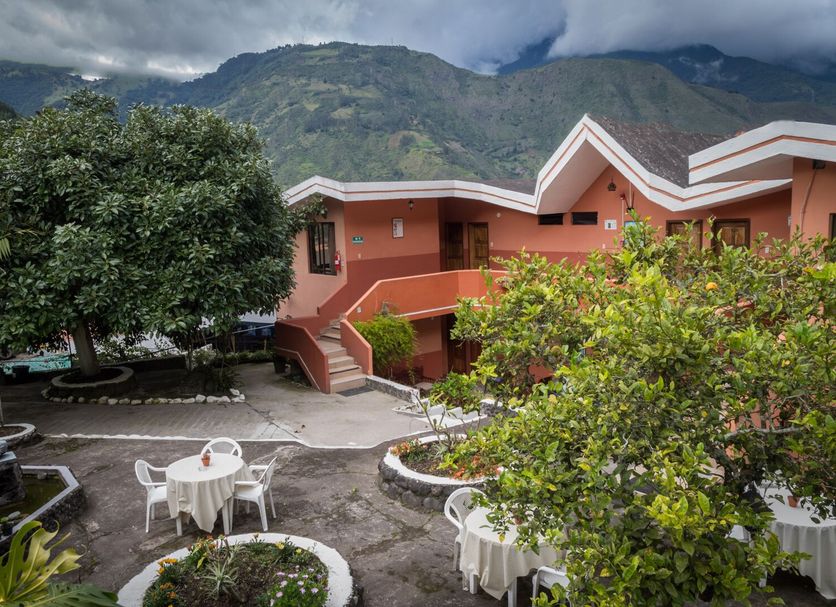 Hosteria Llanovientos in Banos with mountain views and outdoor patio seating