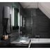 LYRIC Hotel Paris Opera bathroom with glass sink, mirror, bathtub and dark tiled walls in Paris