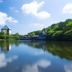 Aomoriya by Hoshino Resorts in Misawa with lake reflections, forested shoreline and blue sky