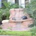 Constellation Hotel in Port Au Prince with a rock waterfall fountain surrounded by tropical greenery