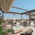 The Oberoi New Delhi rooftop terrace with outdoor seating and city views