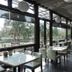 The House of Water in Dongshan Township dining area with floor-to-ceiling windows and garden views