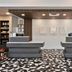 Hilton Garden Inn Birmingham SE/Liberty Park lobby front desk in Birmingham with geometric tile floor