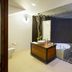 The Deer Park Hotel in Giritale: spa-style bathroom with freestanding tub and indoor plant accents