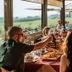 Villa Di Sotto in Castelnuovo Berardenga: guests dining indoors with countryside views