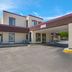 Red Roof Inn Dillon, SC exterior with covered drive-through entrance and parking area