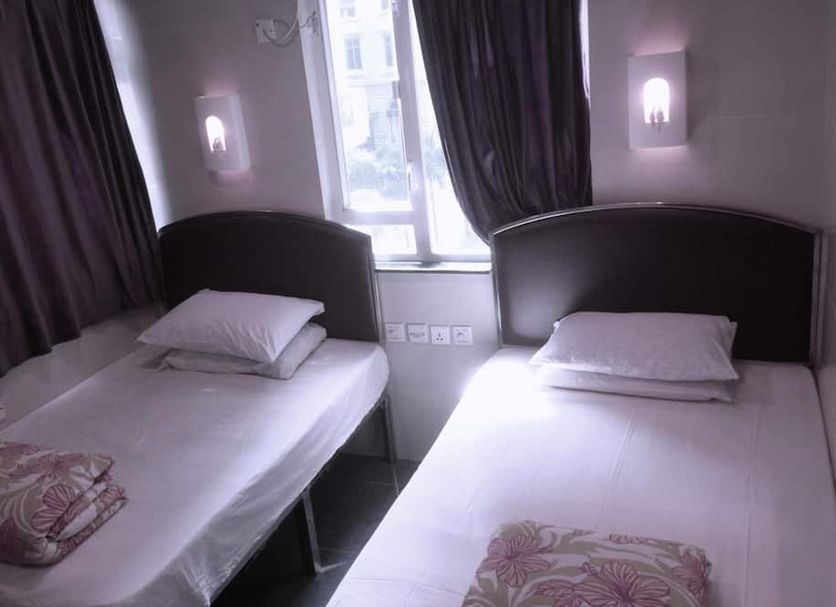 Hong Kong Co-living Space, Kowloon Youth Village room with two single beds and a window in Hong Kong