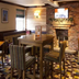 Premier Inn Norwich City Centre - Duke St lounge with fireplace, high tables and striped chairs