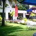 Grand Crown Hotel, Anuradhapura: garden courtyard with patio tables and tropical landscaping