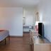 Motel 6 Madras Or guest room with bed, TV, dresser and vanity area in Madras