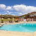 Best Western East Zion Thunderbird Lodge in Mount Carmel, outdoor pool with lounge chairs and mountain backdrop
