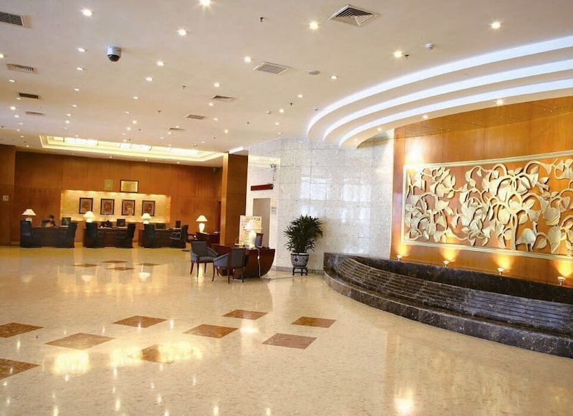 The North Garden Hotel Beijing Wangfujing lobby in Beijing with polished floors, seating, and decorative wall art