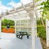 Vacation Village at Bonaventure, Weston: pergola-covered picnic table and barbecue in a landscaped garden
