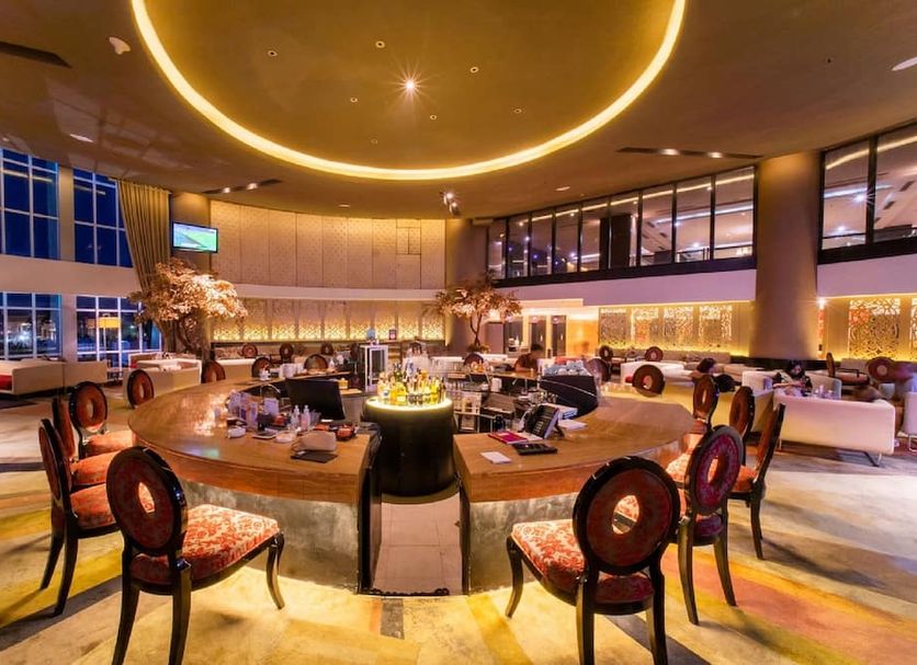 Grand Jatra Hotel Balikpapan lounge with round seating area and large circular ceiling light in Balikpapan