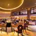 Grand Jatra Hotel Balikpapan lounge with round seating area and large circular ceiling light in Balikpapan