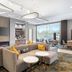 La Quinta Inn & Suites by Wyndham La Habra lobby lounge with sectional seating, fireplace and dining area