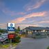 Best Western Black Hills Lodge in Spearfish exterior with parking lot at sunset