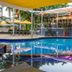 Kununurra Country Club Resort in Kununurra with a pool beside the outdoor bar and shaded seating
