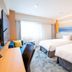 Richmond Hotel Miyazaki Ekimae room with two twin beds, desk, and large window in Miyazaki