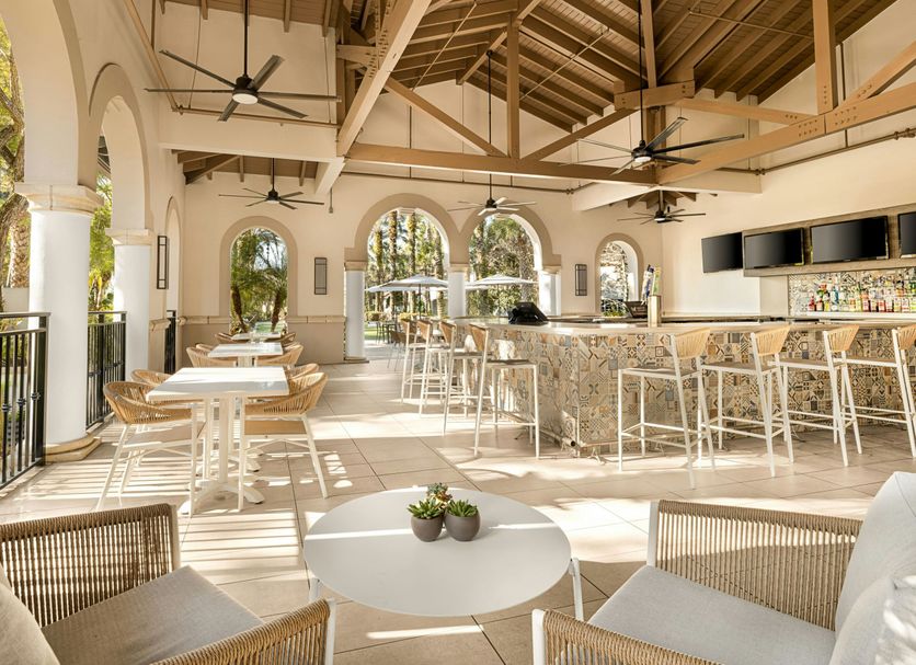 Marriott's Lakeshore Reserve, Orlando: airy outdoor bar and dining area with arched openings and tall stools