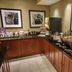 Hampton Inn South Haven breakfast buffet with hot food, coffee station and framed wall art