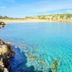 Hotel Noto Marina Vista Mare in Noto overlooking a turquoise cove and rocky shoreline