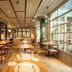 Hospes Las Casas del Rey de Baeza in Seville dining room with tables and large windows