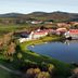 Asara Wine Estate & Hotel in Stellenbosch with vineyard views and a reflective lake