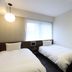 Hotel M's Est Kyoto Station South in Kyoto, twin beds beside a bright window and wall-mounted AC