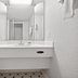 La Quinta Inn by Wyndham Costa Mesa/Newport Beach bathroom vanity with mirror and shower