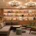 Holiday Inn London - Bloomsbury lobby lounge with sectional sofa, shelves, and modern pendant lights