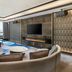 Sheraton Zibo Hotel in Zibo lounge with city view, curved seating, marble table and wall-mounted TV