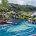 Mandarava Resort And Spa, Karon Beach pool with swim-up bar and hillside views in Karon