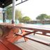 Gyeongju Raon Pension in Gyeongju with covered picnic tables on an outdoor deck