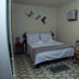 Hotel Vale Verde Penedo room in Penedo with a double bed, small table and wall-mounted TV