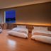 Garden Terrace Nagasaki Hotels & Resorts room with twin beds and panoramic night harbor views in Nagasaki